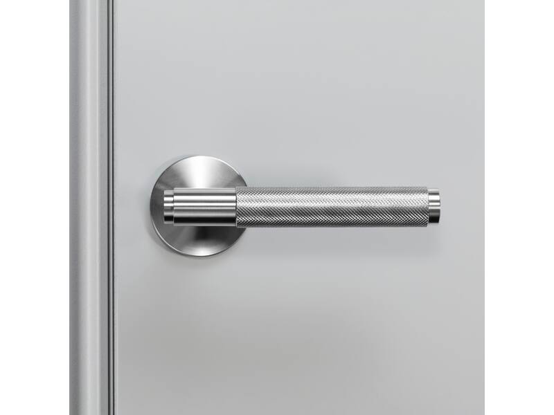Deurkruk Cross RVS diamond-cut op ronde verende rozet 145mm