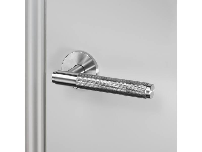 Deurkruk Cross RVS diamond-cut op ronde verende rozet 145mm
